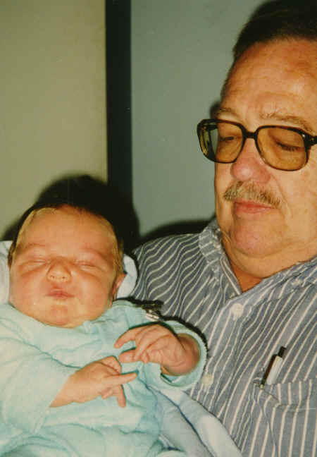 cameron - 3 weeks - held by Ron.jpg (305404 bytes)