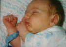 cameron - 3 weeks - asleep in bassenette - #2.jpg (223619 bytes)