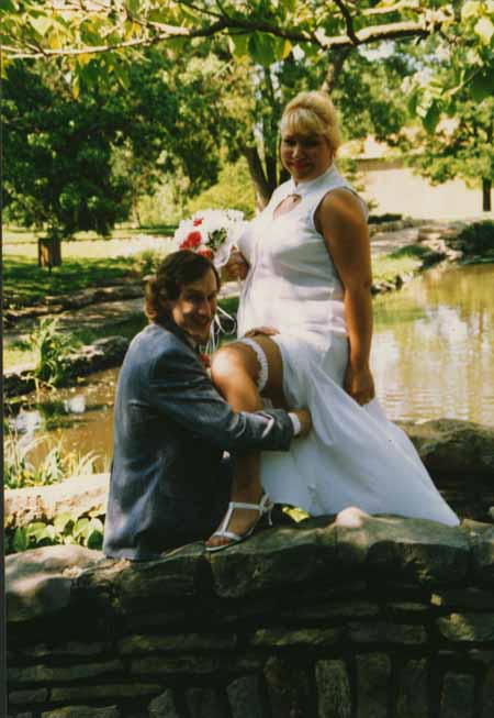 chris - crystal - on bridge removing garter copy.jpg (37143 bytes)