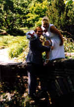 chris - crystal - on bridge removing garter - #2 copy.jpg (47096 bytes)
